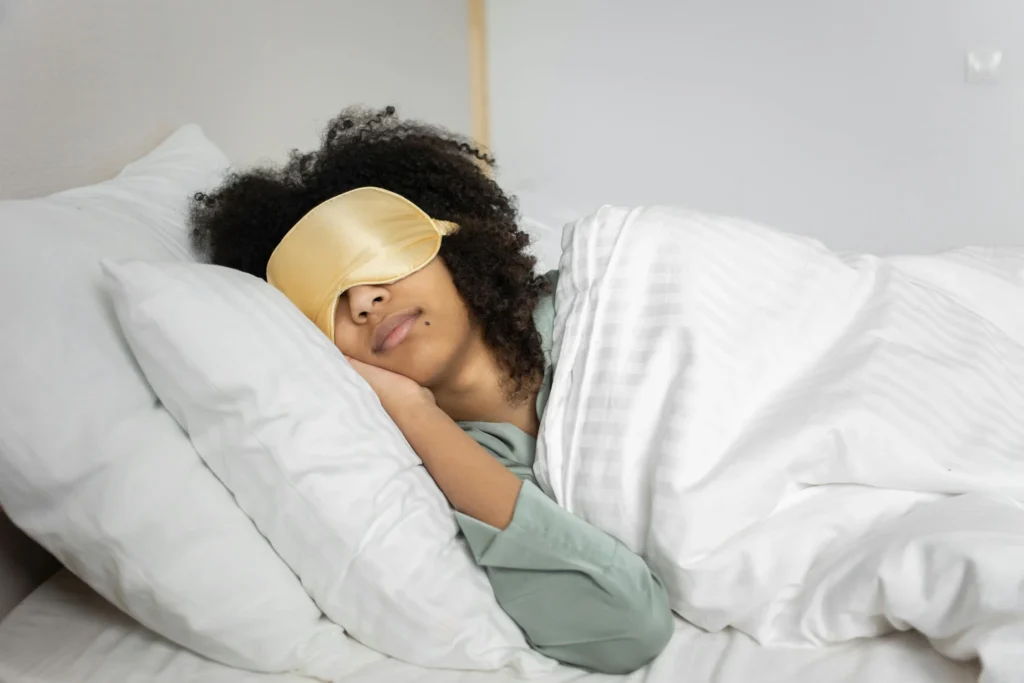 A lady sleeping with sleep masks on