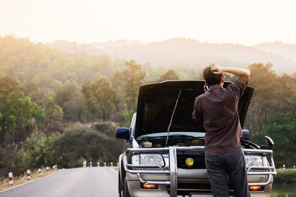 man-try-fix-car-engine-problem