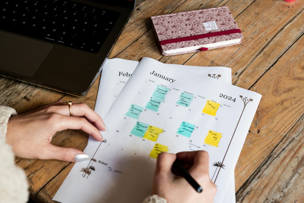Woman writing on a calendar